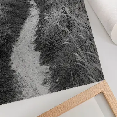 Decoratieve poster met een vuurtoren tegen een achtergrond van hoog gras