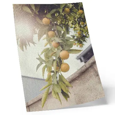 Wandposter boomtak met zon en groene bladeren in oranje tinten
