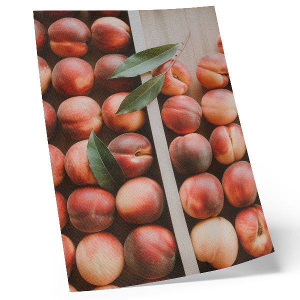 Wandposter Perziken met bladeren in een houten doos
