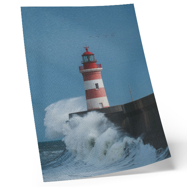 Poster Vuurtoren, blauwe lucht, zeegolven
