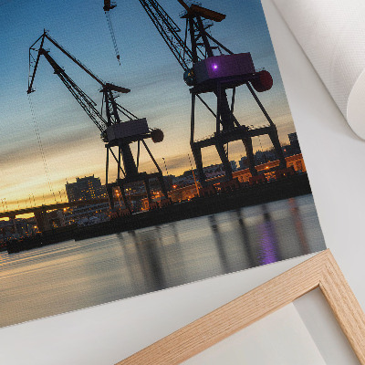 Decoratieve poster Kraanvogels tegen de achtergrond van een dynamische zonsondergang.