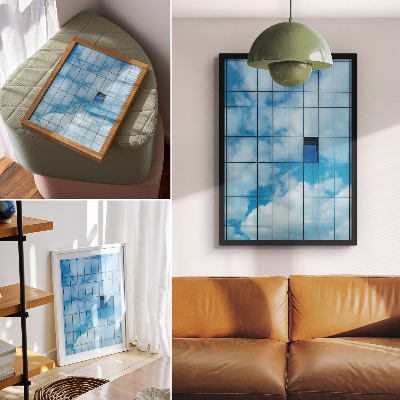 Wandposter Een glazen gevel die de lucht en wolken weerspiegelt.