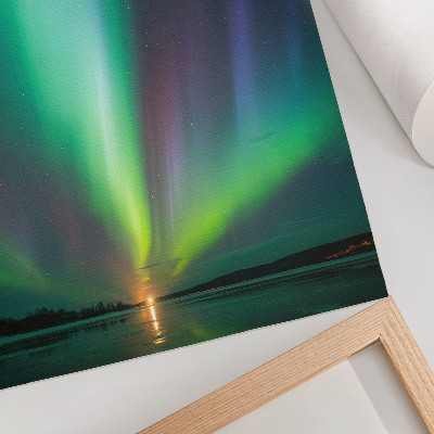 Poster Het noorderlicht boven een nachtelijk landschap vol sterren
