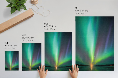 Poster Het noorderlicht boven een nachtelijk landschap vol sterren