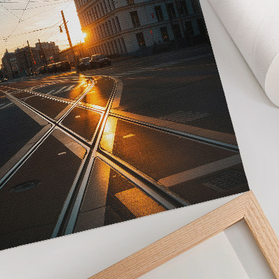 Decoratieve poster De ondergaande zon boven de stad met architectuur.