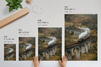 Poster Een trein op een brug tussen groene heuvels