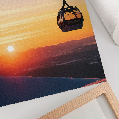Wandposter Kabelbaan bij zonsondergang in de bergen