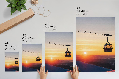 Wandposter Kabelbaan bij zonsondergang in de bergen