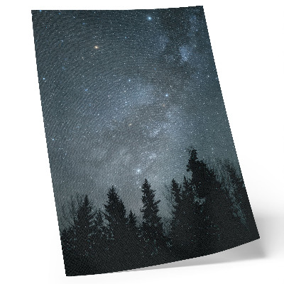 Poster Een nachtelijke hemel vol sterren en silhouetten van bomen.