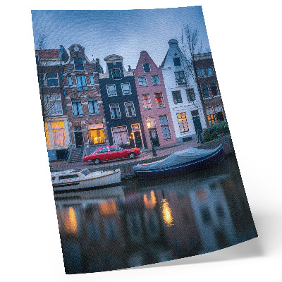 Wandposter Kleurrijke huizenblokken, avondlijke sfeer, weerspiegeld in het water.
