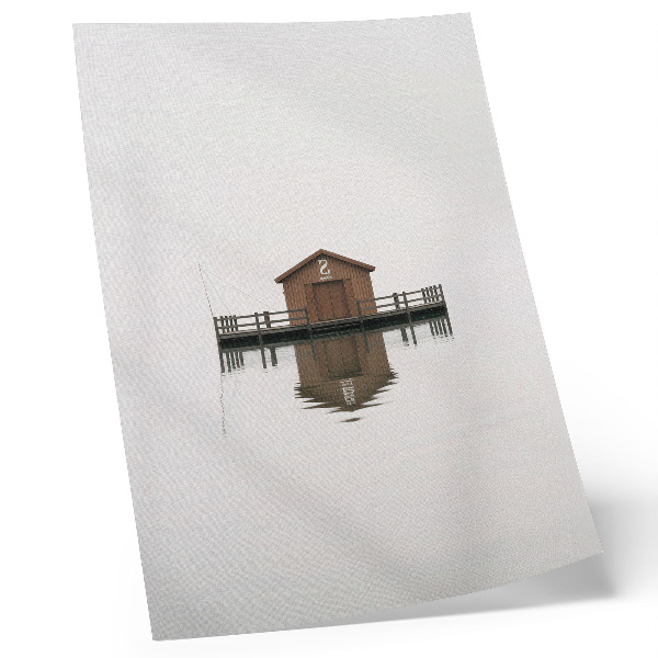 Decoratieve poster Een minimalistisch houten huisje aan het water