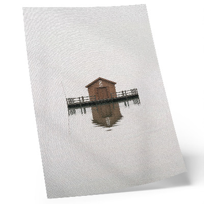 Decoratieve poster Een minimalistisch houten huisje aan het water