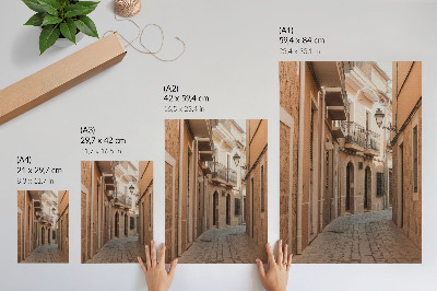 Decoratieve poster Smalle straat, stenen gebouwen, warme tinten