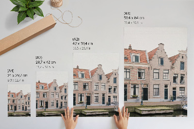 Wandposter Bakstenen huurkazernes met rode pannendaken
