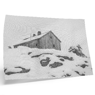 Poster Een minimalistisch winterhuis tegen de achtergrond van sneeuw.