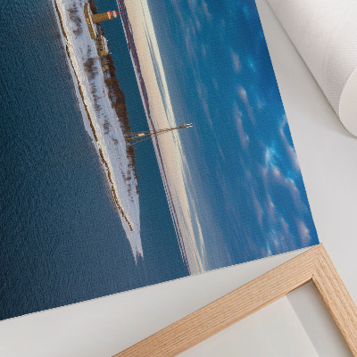 Moderne decoratieve poster Wintereiland met een vuurtoren en een blauwe zee