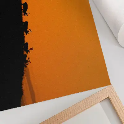 Moderne decoratieve poster met silhouetten van herten op een heuvel tegen een oranje achtergrond