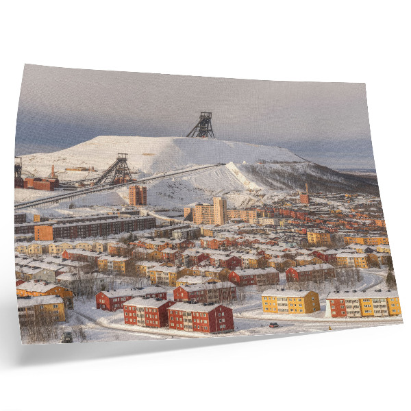 Poster Winterstadje met kleurrijke gebouwen die afsteken tegen de sneeuw.