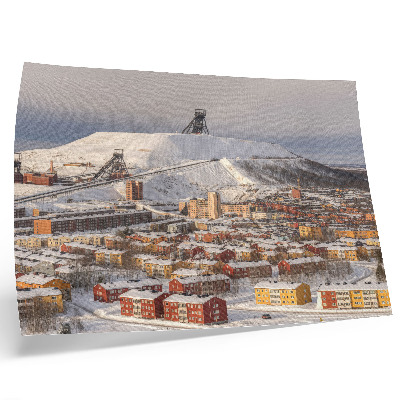 Poster Winterstadje met kleurrijke gebouwen die afsteken tegen de sneeuw.