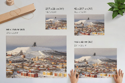 Poster Winterstadje met kleurrijke gebouwen die afsteken tegen de sneeuw.
