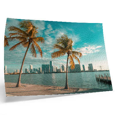 Moderne decoratieve poster Palmbomen, meer, wolkenkrabbers, turkooizen lucht, rust