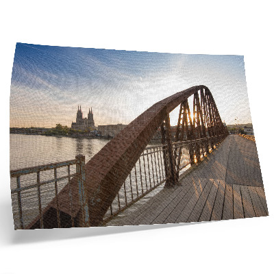 Stijlvolle wandposter metalen brug kathedraal rivier vredige zonsondergang