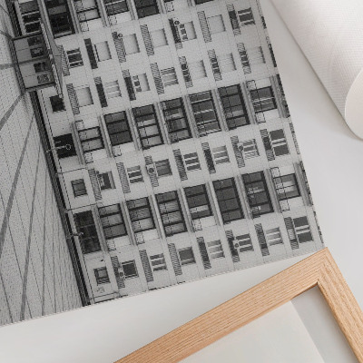 Stijlvolle wandposter Een modern gebouw met balkons en een plein.
