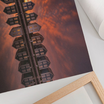 Poster Kleurrijke huizen aan het water in het licht van de zonsondergang.