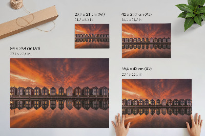 Poster Kleurrijke huizen aan het water in het licht van de zonsondergang.