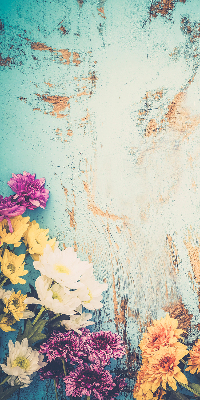 Rolgordijn voor balkondeur met bloemen op een blauwe achtergrond