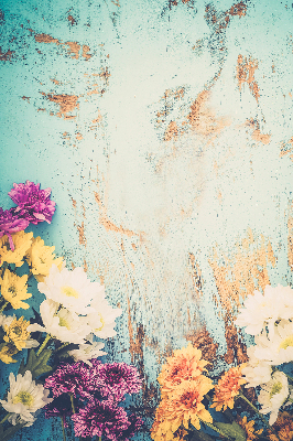 Rolgordijn voor balkondeur met bloemen op een blauwe achtergrond
