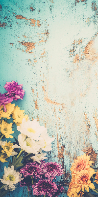 Rolgordijn voor balkondeur met bloemen op een blauwe achtergrond