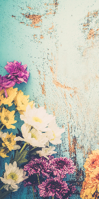 Rolgordijn voor balkondeur met bloemen op een blauwe achtergrond