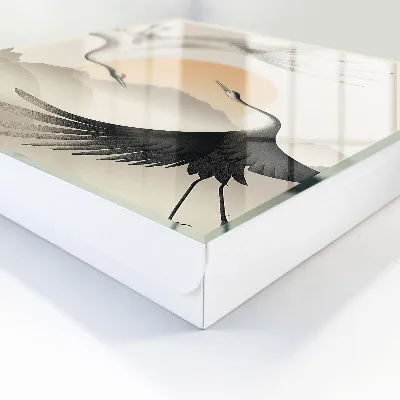 Sleutelkast Japanse kraanvogels tegen de achtergrond van de opkomende zon.