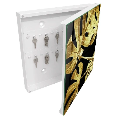 Sleutelkastje binnen Monstera-bladeren