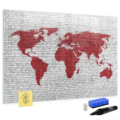 Magnetisch glazen schrijfbord met print van een wereldkaart op een bakstenen muur