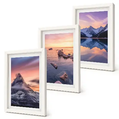 Gallery wall met landschappen van bergen, meren en zonsondergangen