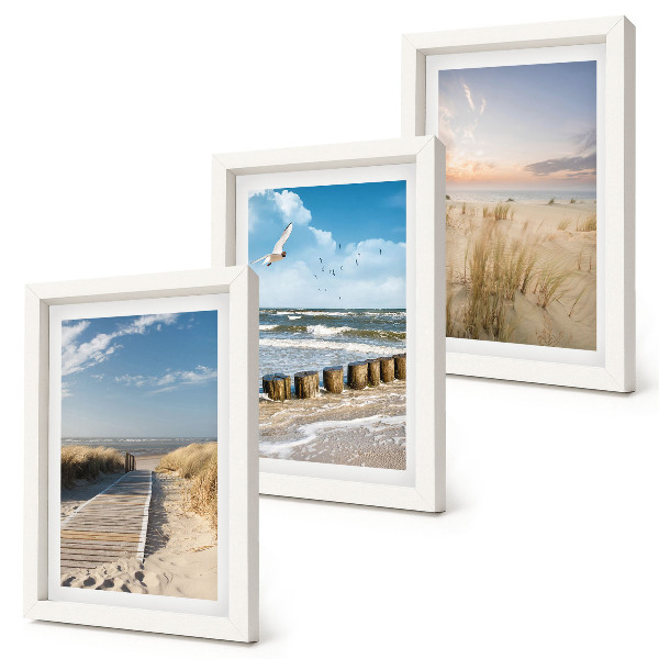 Gallery wall Strand met zand, golven, lucht en vogels in de lucht.