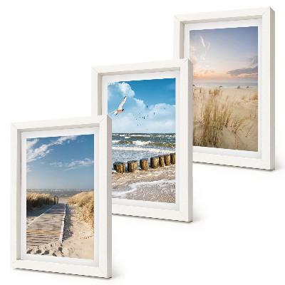 Gallery wall Strand met zand, golven, lucht en vogels in de lucht.