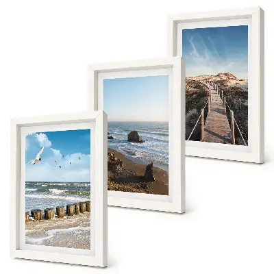 Gallery wall uitzicht op een strand met golven, de lucht en een wandelpier