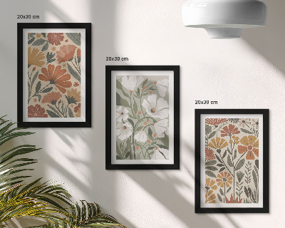 Set van ingelijste schilderijen Bloemmotieven in oranje en groene tinten.