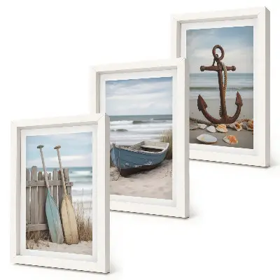 Set ingelijste schilderijen strand met roeiboot en anker in het zand