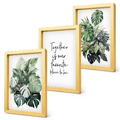 Set van ingelijste schilderijen met tropische groene bladeren en decoratieve inscriptie