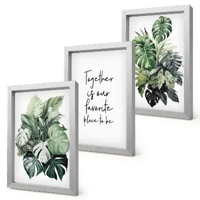 Set van ingelijste schilderijen met tropische groene bladeren en decoratieve inscriptie