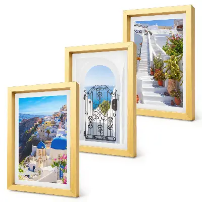 Set van ingelijste schilderijen met uitzichten op Santorini en de Griekse architectuur van Oia