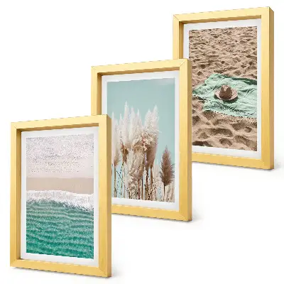 Set van ingelijste schilderijen met strand, gras, hoed en zand voor een natuurlijke ontspanning