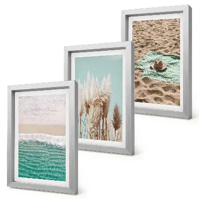 Set van ingelijste schilderijen met strand, gras, hoed en zand voor een natuurlijke ontspanning