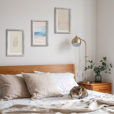 Gallery wall Bladeren en golven in beige en blauwe tinten.