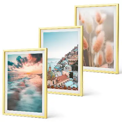 Fotowand met een zonsondergang bij de zee met huizen en bloemen