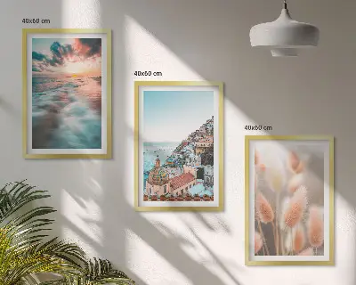 Fotowand met een zonsondergang bij de zee met huizen en bloemen